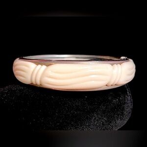 Faux ivory and silver tone hinged bracelet​​​